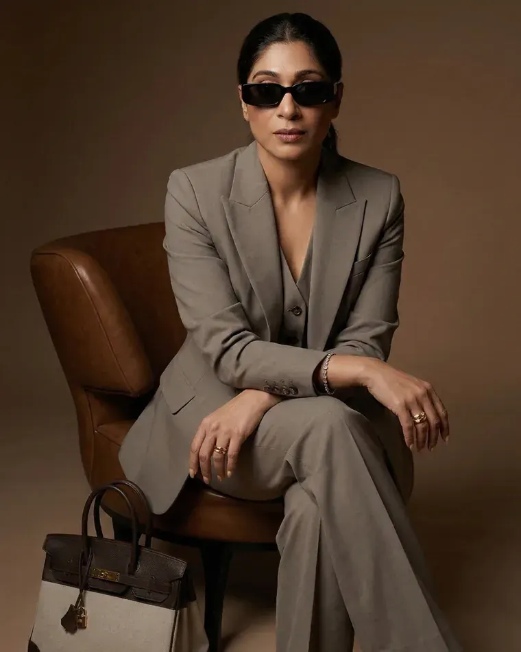 Bandita Patro in a tailored taupe suit