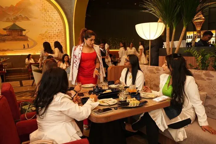 Members in conversation around a table.