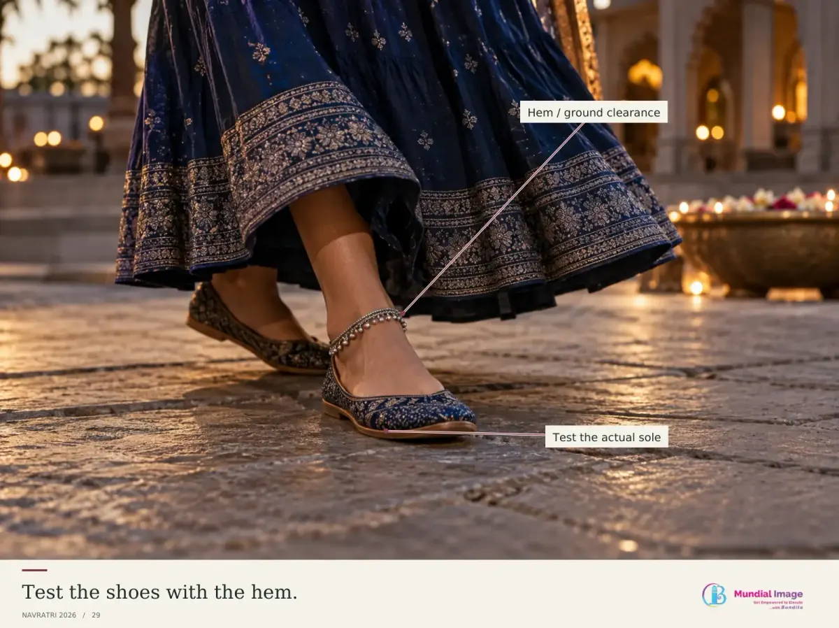 Flat shoes shown on a firm textured surface beside a clear skirt hem.