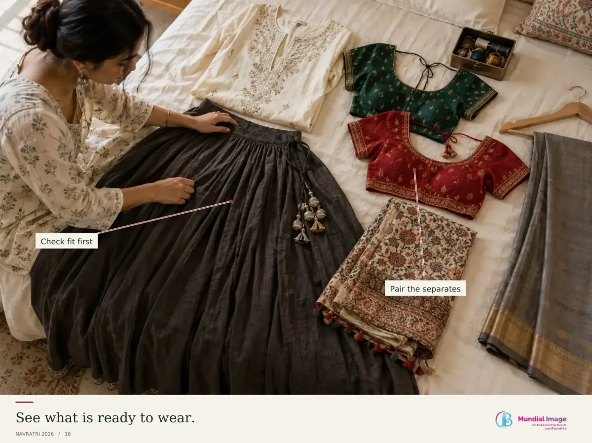 Indian woman checking a dark skirt beside blouses and folded festive textiles laid out for a wardrobe inventory.